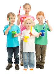 Group of children with kids paint brushes