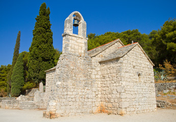 Fototapeta na wymiar Small rural stone church