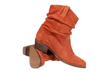 Woman's suede boot isolated on white with clipping path.
