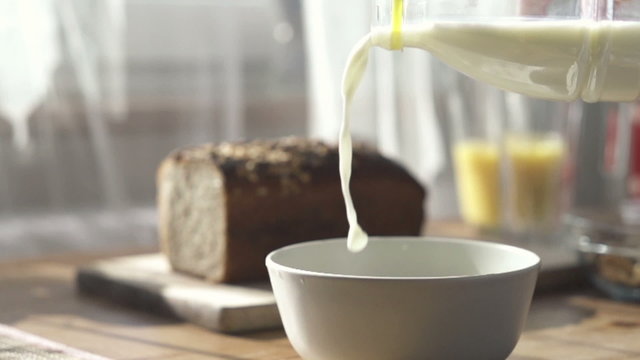 Pouring milk into bowl, slow motion shot at 480fps
