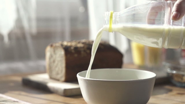 Pouring milk into bowl