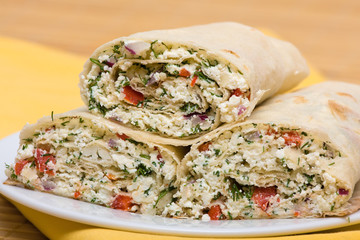 Pita bread wrapped with cottage cheese and vegetables
