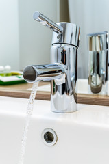 The stream of water from a tap