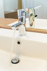 The stream of water from a tap