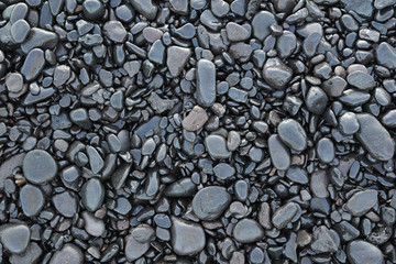 Background of wet black pebbles