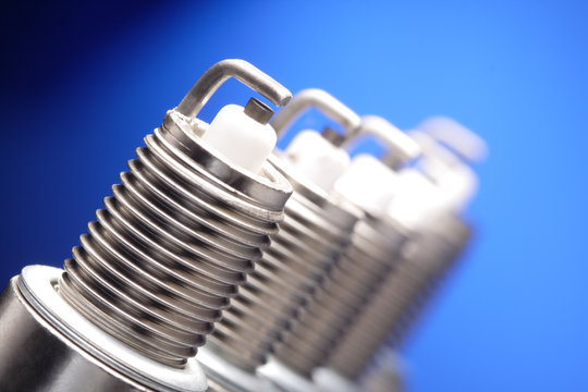 spark plug on blue background