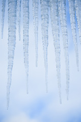 Icicles against blue sky