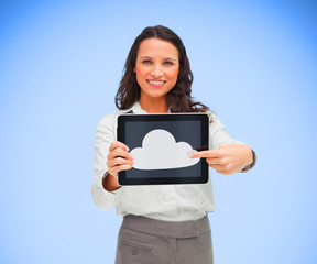 Businesswoman pointing to cloud computing symbol on tablet pc