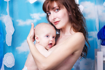 Portrait of angelic baby and his mother