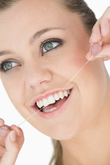 Woman with dental floss