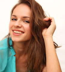 beautiful smiling girl shot on a white background