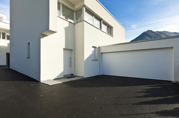 modern house white, view from the courtyard with garage