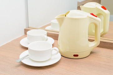 Fototapeta na wymiar Tea cups and kettle