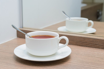 Cup of tea in the mirror