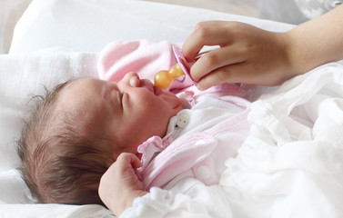Healthy baby on the bed.