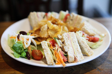 Club sandwich with on wood background