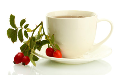 cup of tea with hip roses, isolated on white