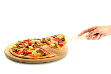 woman's hand holding a slice of pizza