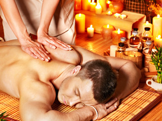 Man getting aroma massage in spa.