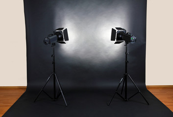 Empty photo studio with lighting equipment