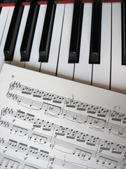 Fototapeta premium Piano keys with notes, musical background.