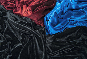 blue red and black glossy velvet with folds