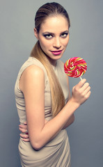 Portrait of beautiful teenager with candy happy isolated