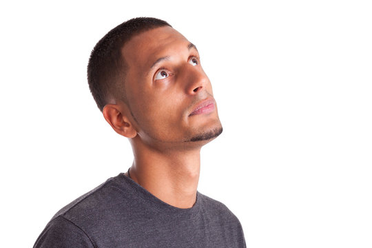 Close up portrait of a young african american man looking up
