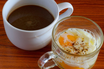 Soft boiled egg and coffee