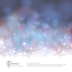 winter background with snow and defocused lights