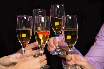 People hands with crystal glasses full of champagne