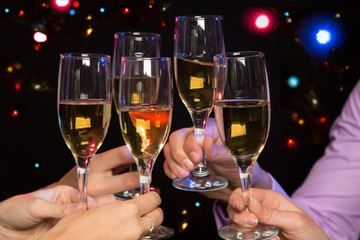 Happy Christmas. People hands with crystal glasses/