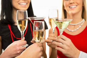 Happy Christmas. People hands with crystal glasses/