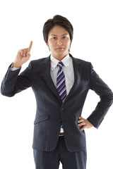 Young businessman pointing upward