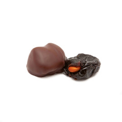 Prunes stuffed with walnuts. Dried fruit in chocolate.