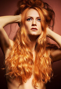 Fashion portrait of sensual redhead young woman