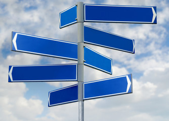 Blank blue direction sign with 8 arrows isolated on sky