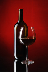 Special red wine bottle with glass