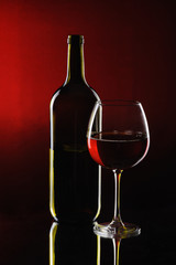 Special red wine bottle with glass