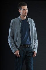 Handsome man dark winter fashion. Studio shot.