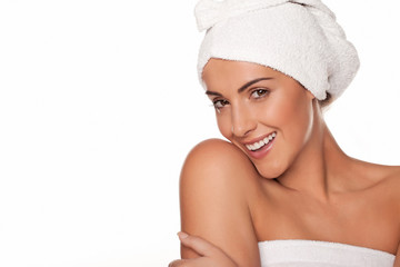 Beautiful woman wrapped in bath towels