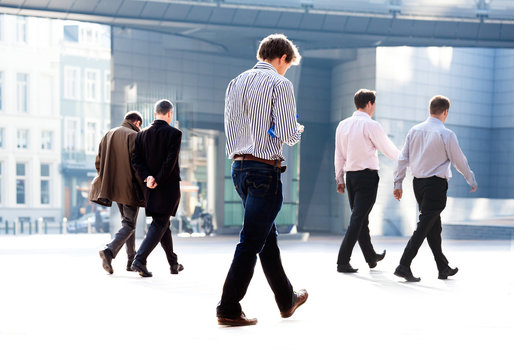 Employees going against the office. Panorama.