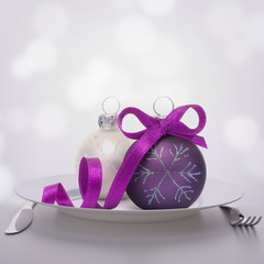 Christmas ball decoration on plate.