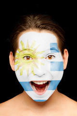 girl with uruguayan flag on her face