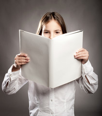 little girl reading a book