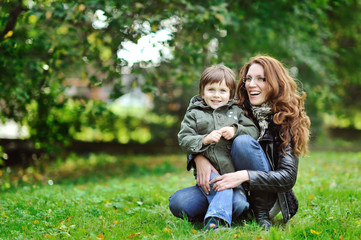 Mother and son having fun in a park