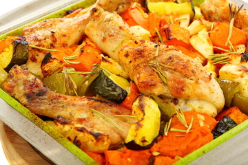 Chicken baked with pumpkin and rosemary.