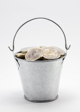 Bucket with euro coins. Clipping path