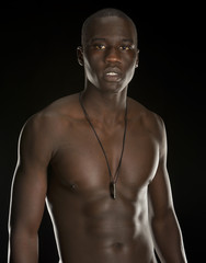 Fototapeta premium Young black man isolated on black