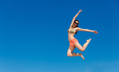 Portrait of young woman in bikini at beach